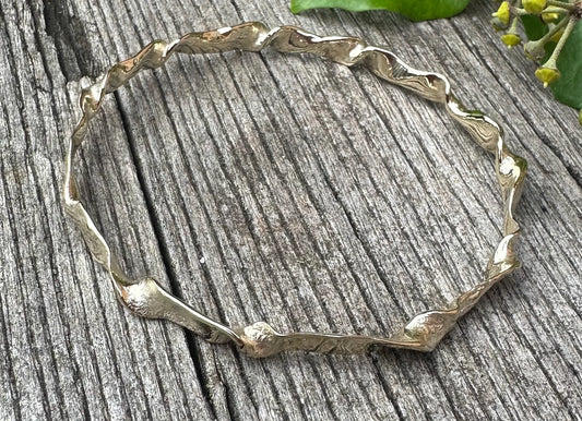 Elegant handcrafted solid silver bangle